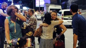 People embrace outside the airport (ABC News)