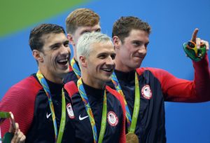 RIO DE JANEIRO, BRAZIL - AUGUST 9: Michael Phelps, Ryan Lochte, Conor Dwyer, Francis Haas (hidden) of Team USA celebrate winning the gold medal during the medal ceremony of the men's 200m freestyle relay on day 4 of the Rio 2016 Olympic Games at Olympic Aquatics Stadium on August 9, 2016 in Rio de Janeiro, Brazil. (Photo by Jean Catuffe/Getty Images)