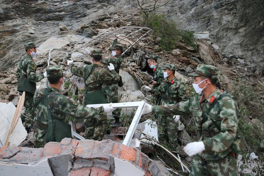 100 feared dead in massive landslide in China