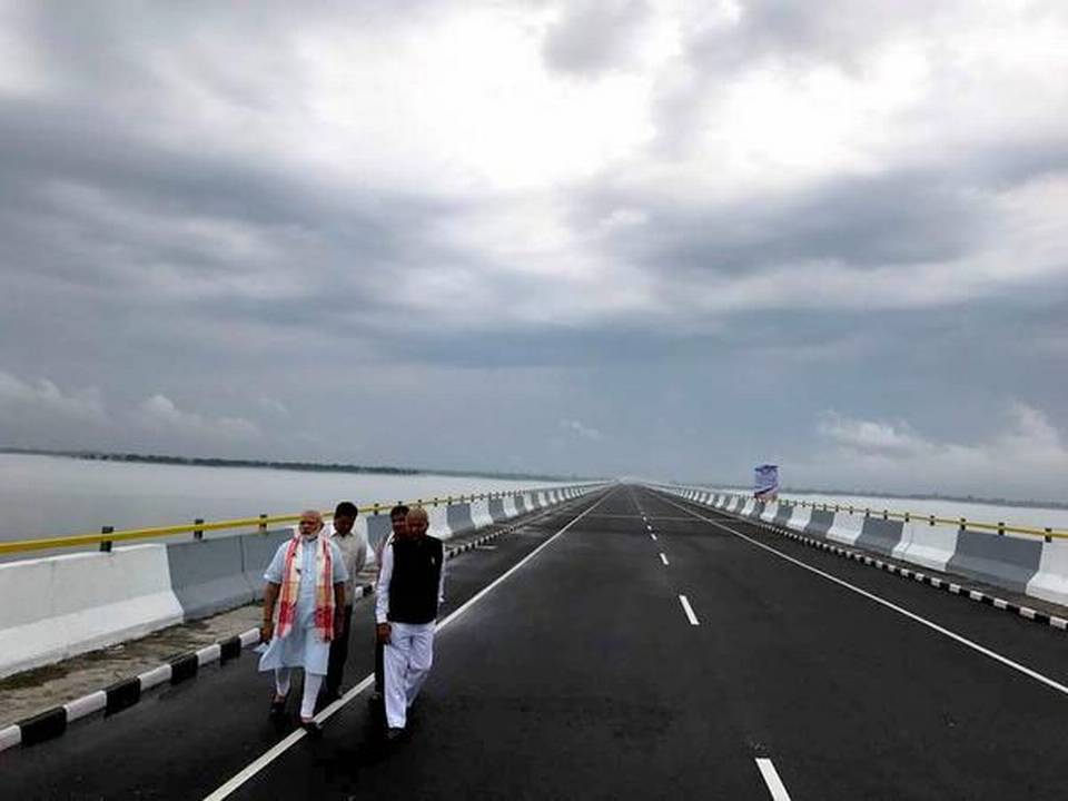 What is common between Kochi Metro and Dhola Sadiya Bridge?