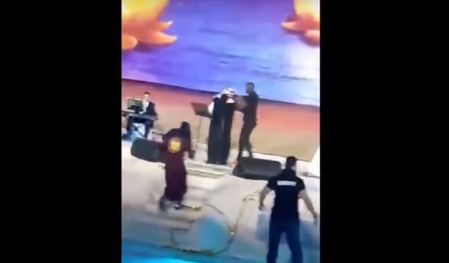 Saudi woman arrested for hugging male singer