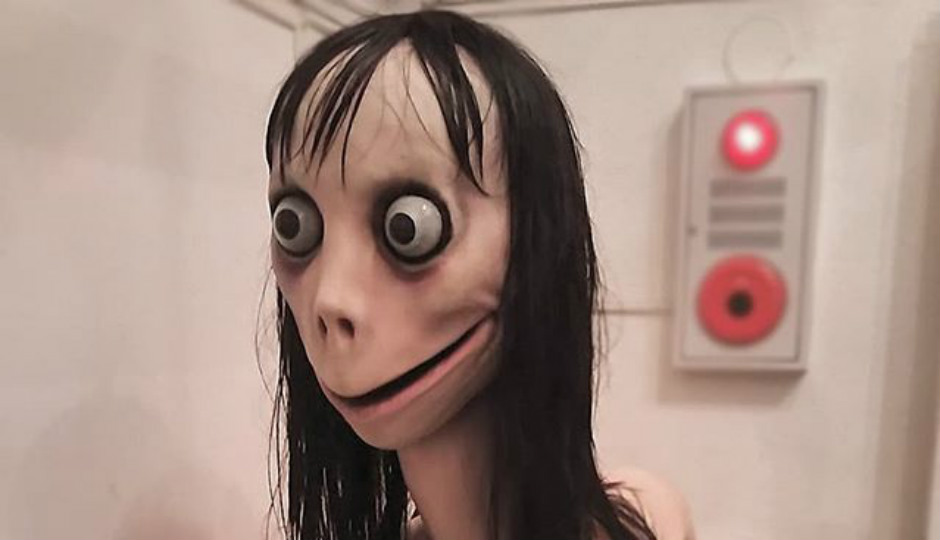 Momo- a bird-women character which has a display picture of a creepy, thin woman with bulging eyes