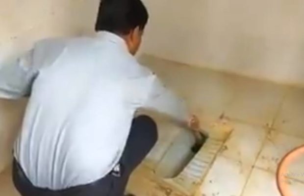 Block education officer cleans school toilet due to shortage of cleaning staff