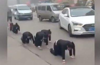 Chinese employees who failed to meet year-end targets forced to crawl on road as punishment