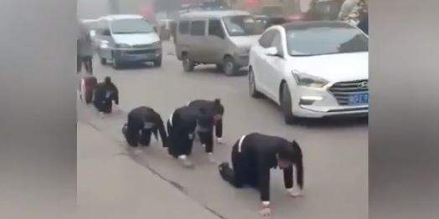 Chinese employees who failed to meet year-end targets forced to crawl on road as punishment