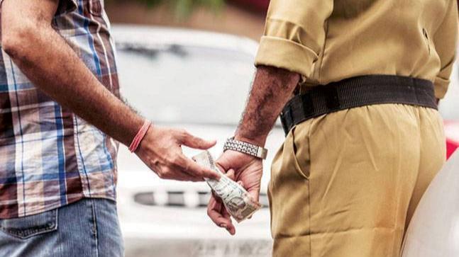 Caught taking bribe, officer flushes down currency