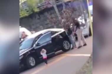 Toddler walks towards police in a surrendering position, video goes viral