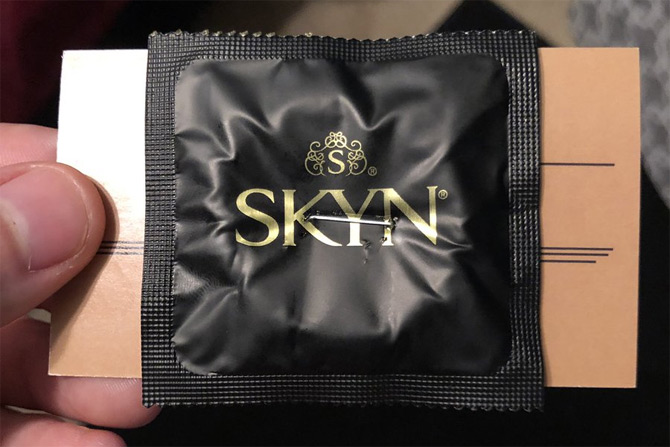 Barber gives condom with business card, netizens reacts to his defective marketing strategy
