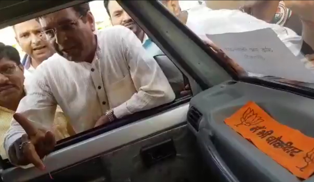 Uttarakhand: Congress members find BJP Chowkidar Cap in Election commission vehicle