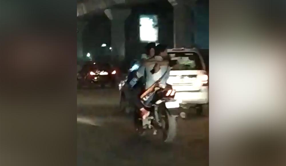 Delhi couple’s PDA on moving bike goes viral, netizens demands action