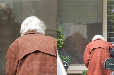 Coronavirus: Heartbreaking photos of 89-year-old US man in isolation talks to wife through a glass window