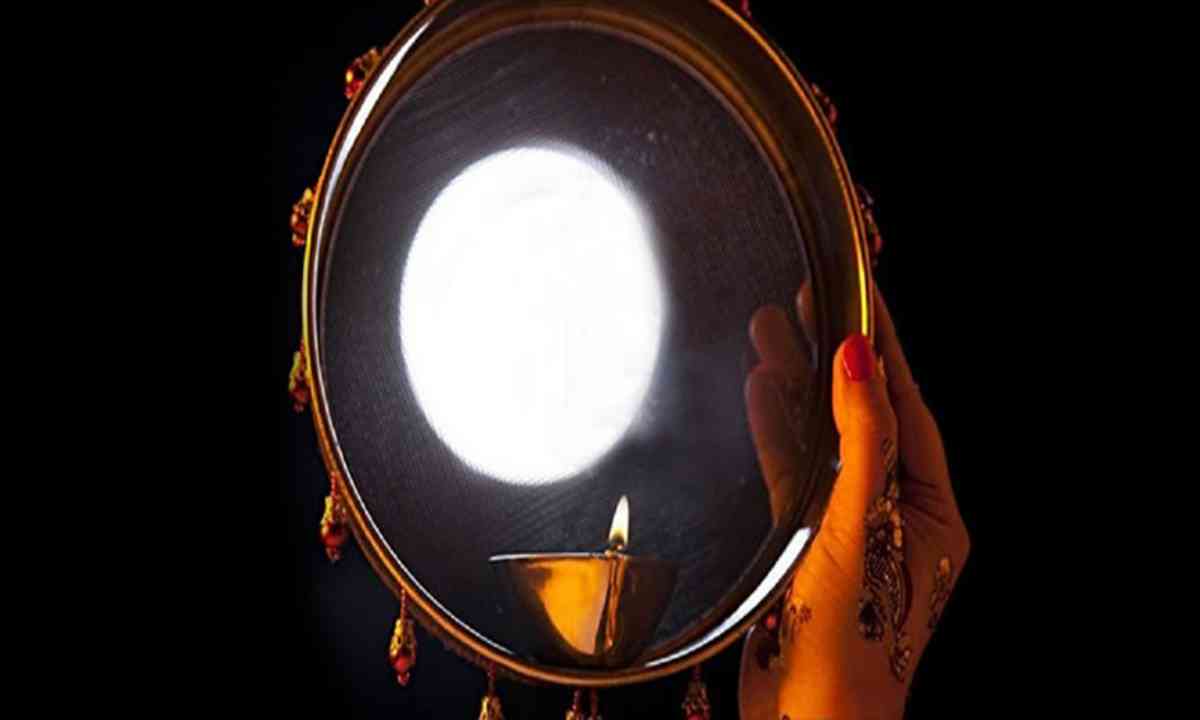 What is the reason behind seeing the moon through a sieve on karwa chauth?