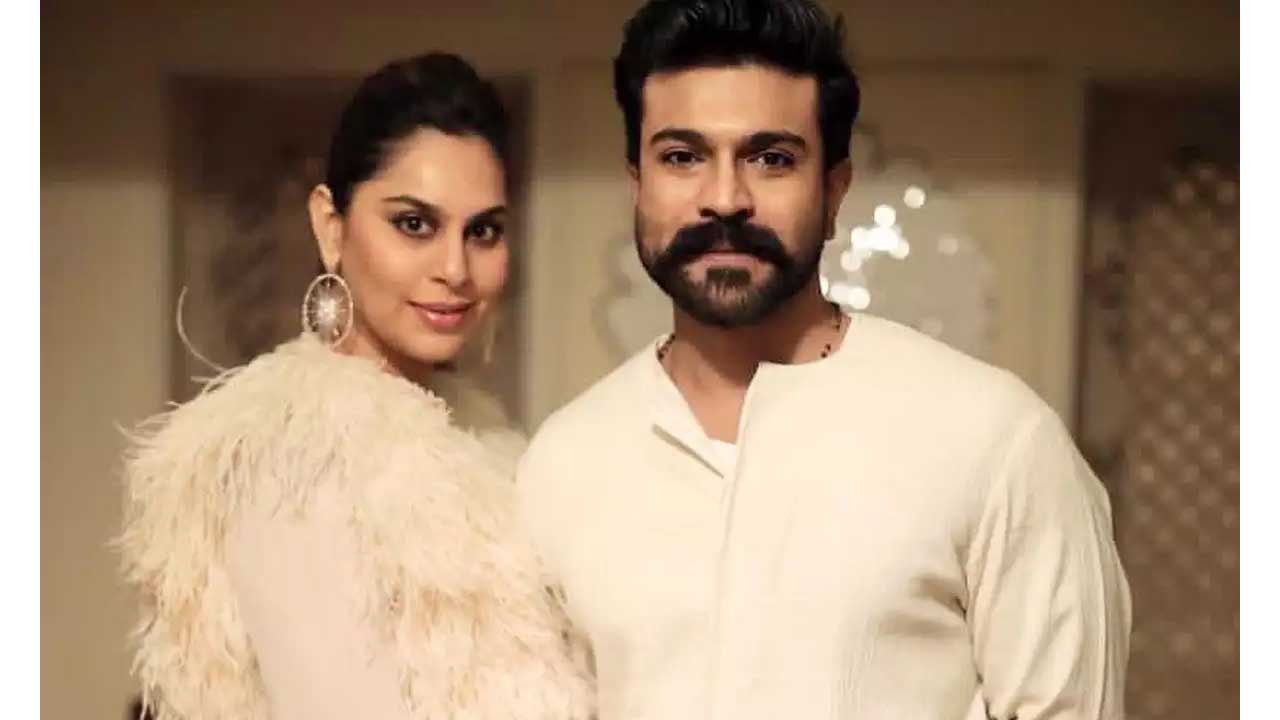 Ram Charan's wife Upasana happily throws confetti at a theatre screen while watching 'RRR'