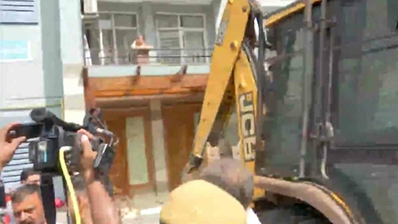 Bulldozer removes illegal structures outside politician Shrikant Tyagi's Noida flat
