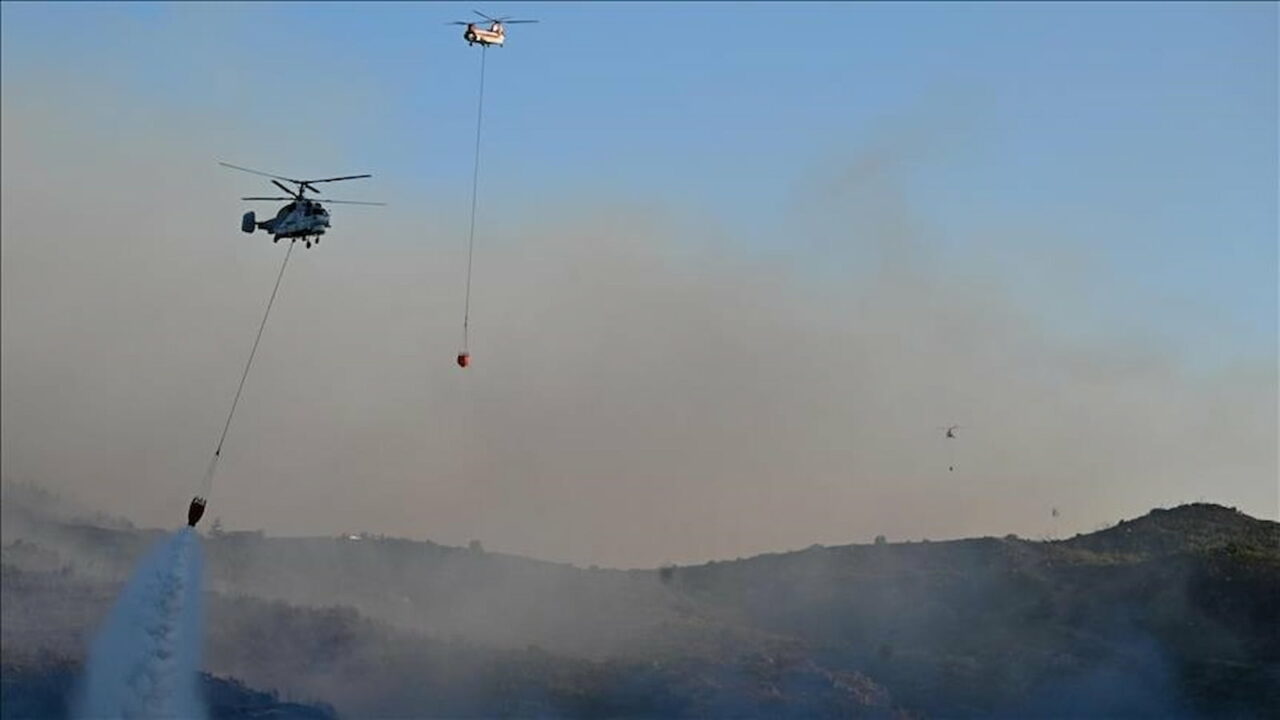 Underwater teams search for a helicopter that crashed while fighting a forest fire in western Turkiye