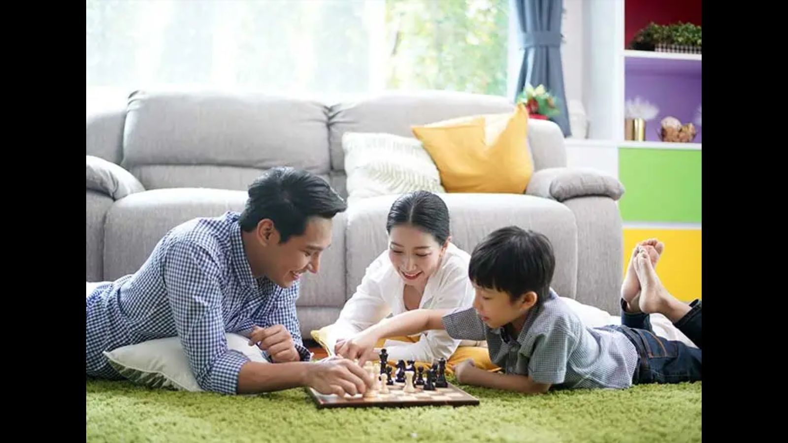 A lovely family playing chess