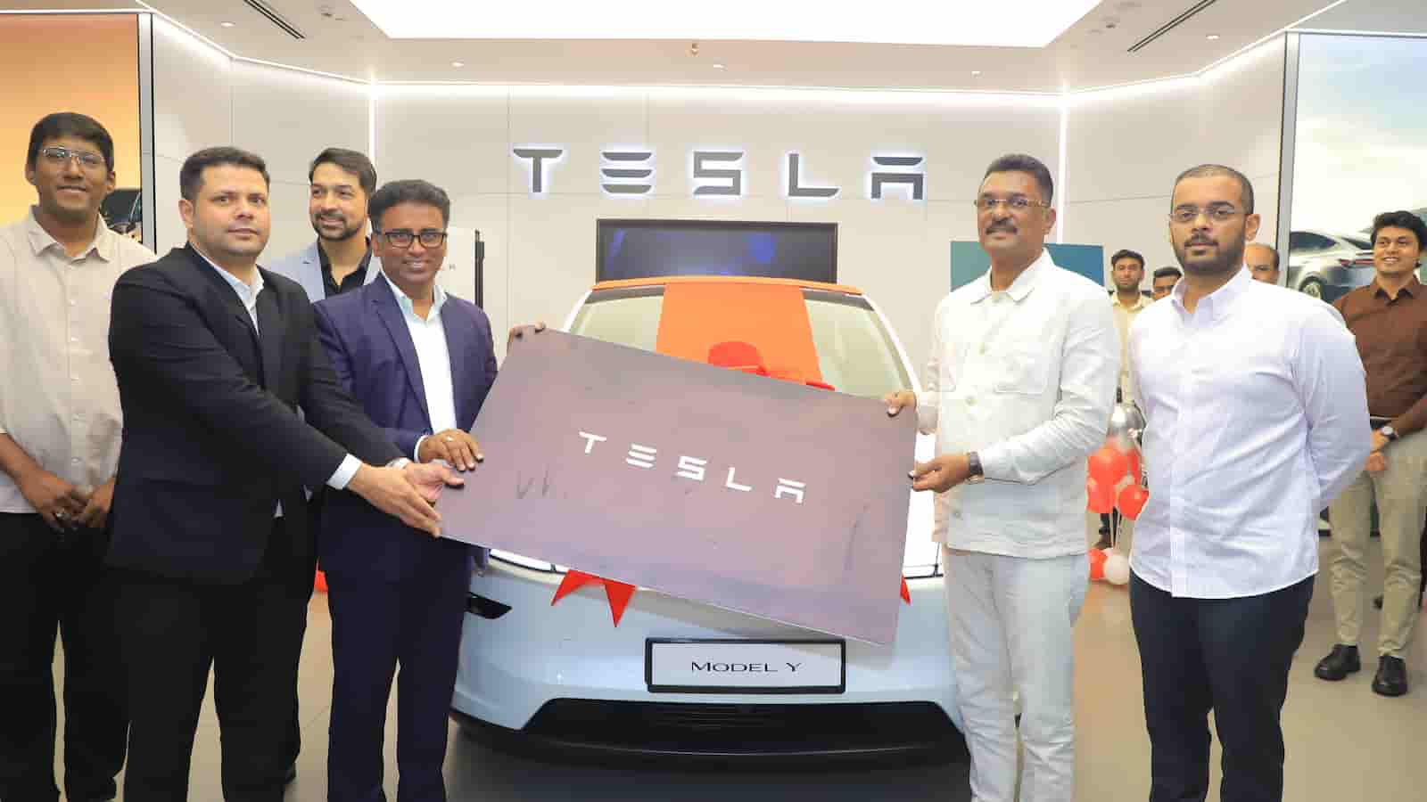 Maharashtra minister Sarnaik receives first delivery of car from Tesla showroom in Mumbai