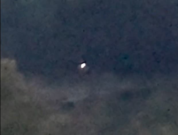 A frame from the "Orbs Over the Pond" video, capture by an eyewitness on an iPhone in October 2024 in the northeastern U.S.